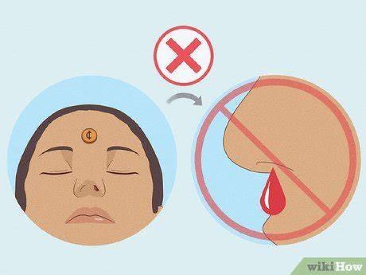 How does a penny stop a nosebleed?